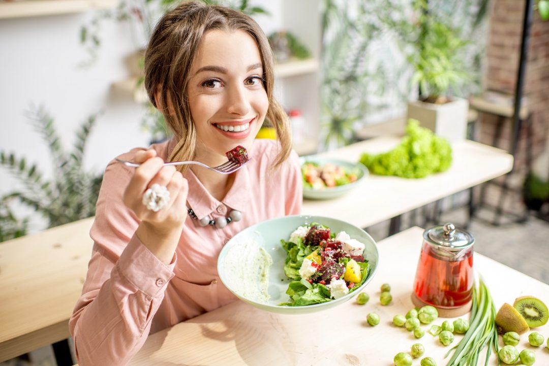 woman eating healthy green food